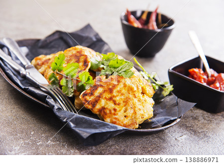 Chicken cutlets with fresh greens and sauce. Healthy home food for dieting. Chicken cutlets with fresh greens and sauce. Healthy home food for dieting. 138886971
