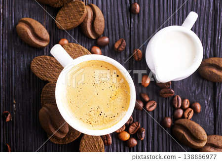 cookies and coffee cup on a table 138886977