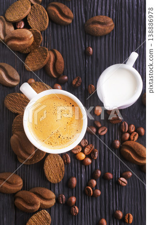 cookies and coffee cup on a table 138886978