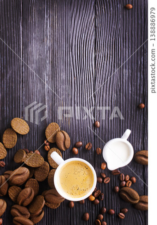 cookies and coffee cup on a table 138886979