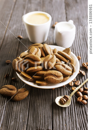 cookies and coffee cup on a table 138886981