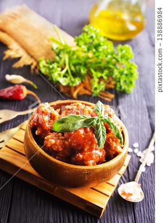 Meatballs in red chipotle chili and tomato sauce, 138886984