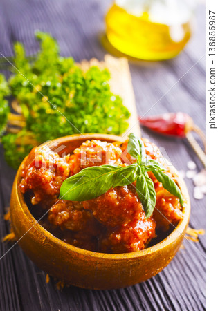 Meatballs in red chipotle chili and tomato sauce, 138886987