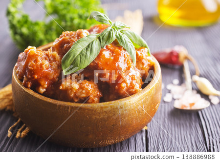 Meatballs in red chipotle chili and tomato sauce, 138886988