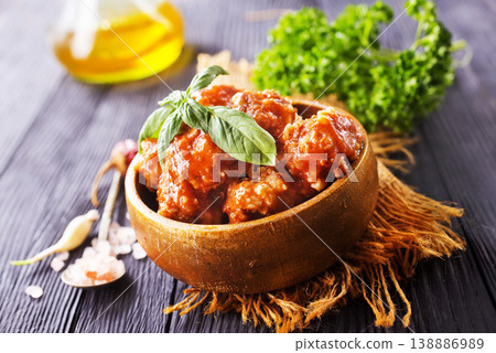 Meatballs in red chipotle chili and tomato sauce, 138886989