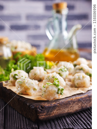 raw chicken balls on wooden board raw chicken balls on wooden board 138886996