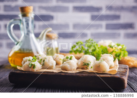raw chicken balls on wooden board 138886998
