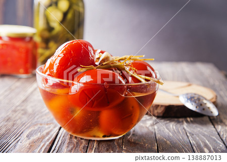 Assortie Jars of Marinated vegetables picles tomato on a wooden background Assortie Jars of Marinated vegetables picles tomato on a wooden background 138887013