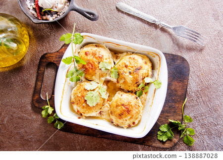 baked chicken cutlets in white bowl 138887028