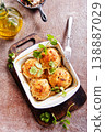baked chicken cutlets in white bowl 138887029