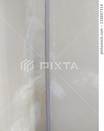Wall seam joint with plaster repair on corner surface Wall seam joint with plaster repair on corner surface 138887314
