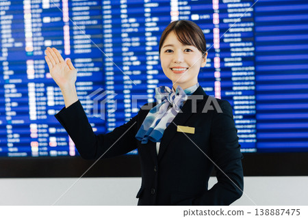 Female airport ground staff providing guidance. (Photography courtesy of Kansai International Airport (KIX)) Female airport ground staff providing guidance. (Photography courtesy of Kansai International Airport (KIX)) 138887475