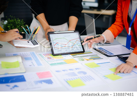 Business team collaboration discussing working analyzing with financial data and marketing growth report graph in team, presentation and digital tablet, laptop 138887481
