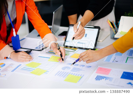 Business team collaboration discussing working analyzing with financial data and marketing growth report graph in team, presentation and digital tablet, laptop 138887490