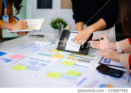 Business team collaboration discussing working analyzing with financial data and marketing growth report graph in team, presentation and digital tablet, laptop 138887492