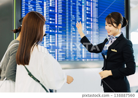 Female airport ground staff guiding travelers (Photo courtesy of Kansai International Airport (KIX)) 138887560