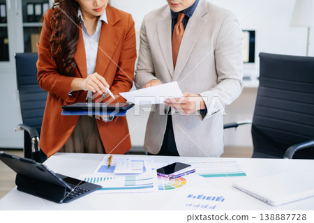 Businessman and team analyzing financial statement Finance task. with smart phone and laptop and tablet. Businessman and team analyzing financial statement Finance task. with smart phone and laptop and tablet. 138887728