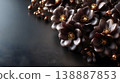 Elegant background material featuring sophisticated black flowers and gold accents, with a margin. 138887853