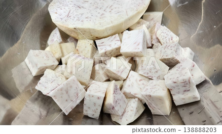 Fresh Raw Diced Taro Root Cubes and Slices in Stainless Steel Bowl 138888203