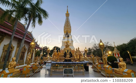 Wat Phra That Phanom Temple with Golden Buddha Statues at Sunset, Nakhon Phanom, Thailand 138888209