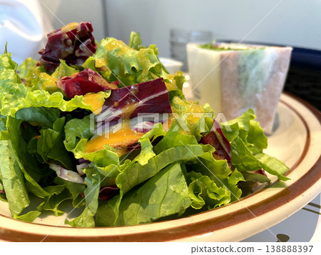 Green Salad - A leafy salad with plenty of dressing (close-up view) Green Salad - A leafy salad with plenty of dressing (close-up view) 138888397