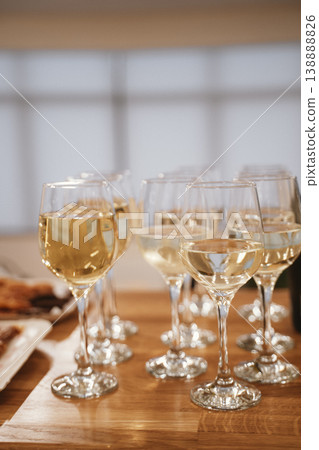 Elegant White Wine Glasses Arranged for a Formal Gathering Elegant White Wine Glasses Arranged for a Formal Gathering 138888826