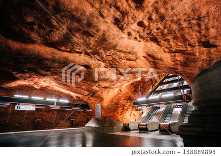 Raw red rock cave tunnel at Radhuset metro station, Stockholm, Sweden Raw red rock cave tunnel at Radhuset metro station, Stockholm, Sweden 138889893