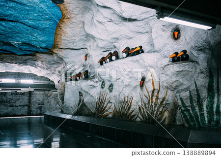 White rock wall with sculpted figurines at Stadion metro station, Stockholm 138889894