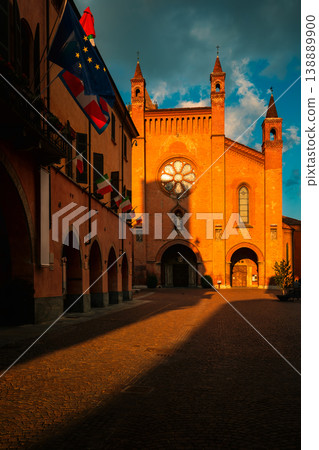 San Lorenzo cathedral illuminated by evening sun in Alba, Italy. San Lorenzo cathedral illuminated by evening sun in Alba, Italy. 138889900
