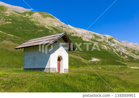 Small chapel on alpine meadow in France. Small chapel on alpine meadow in France. 138889901