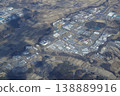 A view of rice fields and buildings from the air. 138889916