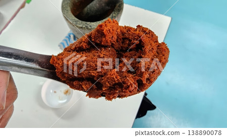 Authentic Thai Red Curry Paste on Spoon with Mortar and Pestle Authentic Thai Red Curry Paste on Spoon with Mortar and Pestle 138890078