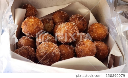 Delicious Golden Fried Sweet Potato Balls Coated in Sugar in a Takeaway Box Delicious Golden Fried Sweet Potato Balls Coated in Sugar in a Takeaway Box 138890079