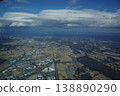 Oblique photograph of rice fields and buildings viewed from the air. 138890290
