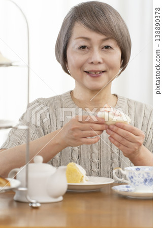 Senior women enjoying afternoon tea Senior women enjoying afternoon tea 138890378