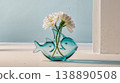 A blue background with white flowers in a glass vase. 138890508