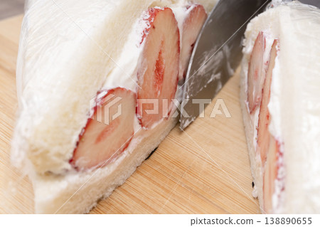 The process of making a strawberry fruit sandwich The process of making a strawberry fruit sandwich 138890655