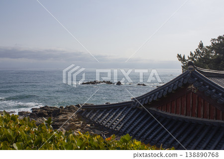 It is a tiled roof and a seascape. 138890768