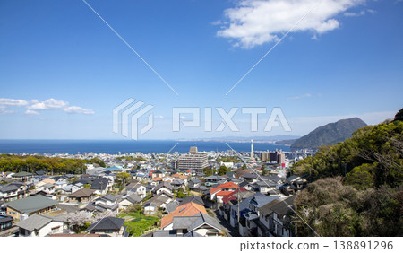 A view of Beppu city from the top of a hill, with Oita city visible in the distance. A view of Beppu city from the top of a hill, with Oita city visible in the distance. 138891296