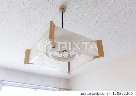 Japanese-style ceiling light fixture with a circular fluorescent lamp. Japanese-style ceiling light fixture with a circular fluorescent lamp. 138891366