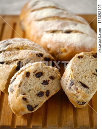 Raisin and orange peel bread - sliced image (vertical orientation) Raisin and orange peel bread - sliced image (vertical orientation) 138892105
