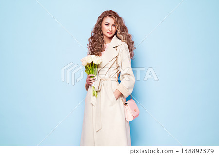 Young woman in white spring coat Young woman in white spring coat 138892379