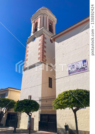 A bright white street lined with colorful flower pots and blooming plants creates a charming Mediterranean scene in Estepona, Spain A bright white street lined with colorful flower pots and blooming plants creates a charming Mediterranean scene in Estepona, Spain 138892424