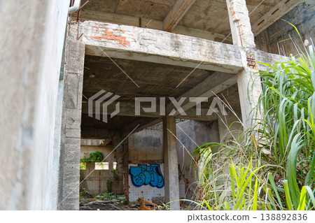 Abandoned Concrete Structure with Exposed Beams and Overgrown Grass Taichung Abandoned Concrete Structure with Exposed Beams and Overgrown Grass Taichung 138892836