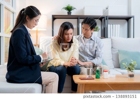 Asian couple therapy counseling and relationship support, mental health, consultation about anxiety. Asian couple therapy counseling and relationship support, mental health, consultation about anxiety. 138893151