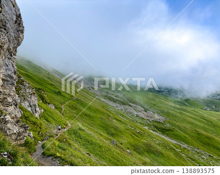 Hiking trail in alpine fog above Les Contamines-Montjoie, France Hiking trail in alpine fog above Les Contamines-Montjoie, France 138893575