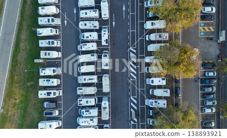 Aerial view of recreational vehicles parked in rows at Piazzale Azzuri d'Italia parking lot, Cremona, Italy 138893921