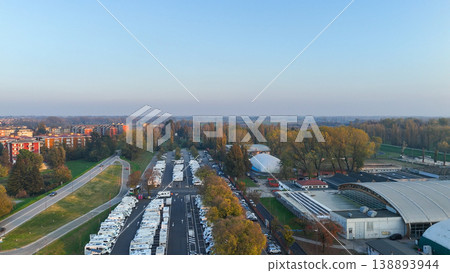 Piazzale Azzuri d'Italia in Cremona operating as a tourist camper parking facility, aerial view of RVs and motorhomes 138893944