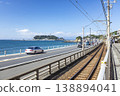 In front of Shonan Kamakura High School: Enoshima Island, National Route 134, and the Enoden railway line along the coast. 138894041