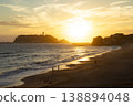 The setting sun over Enoshima Island in front of Shonan Kamakura High School. 138894048
